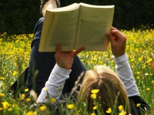 reading-a-book-in-field